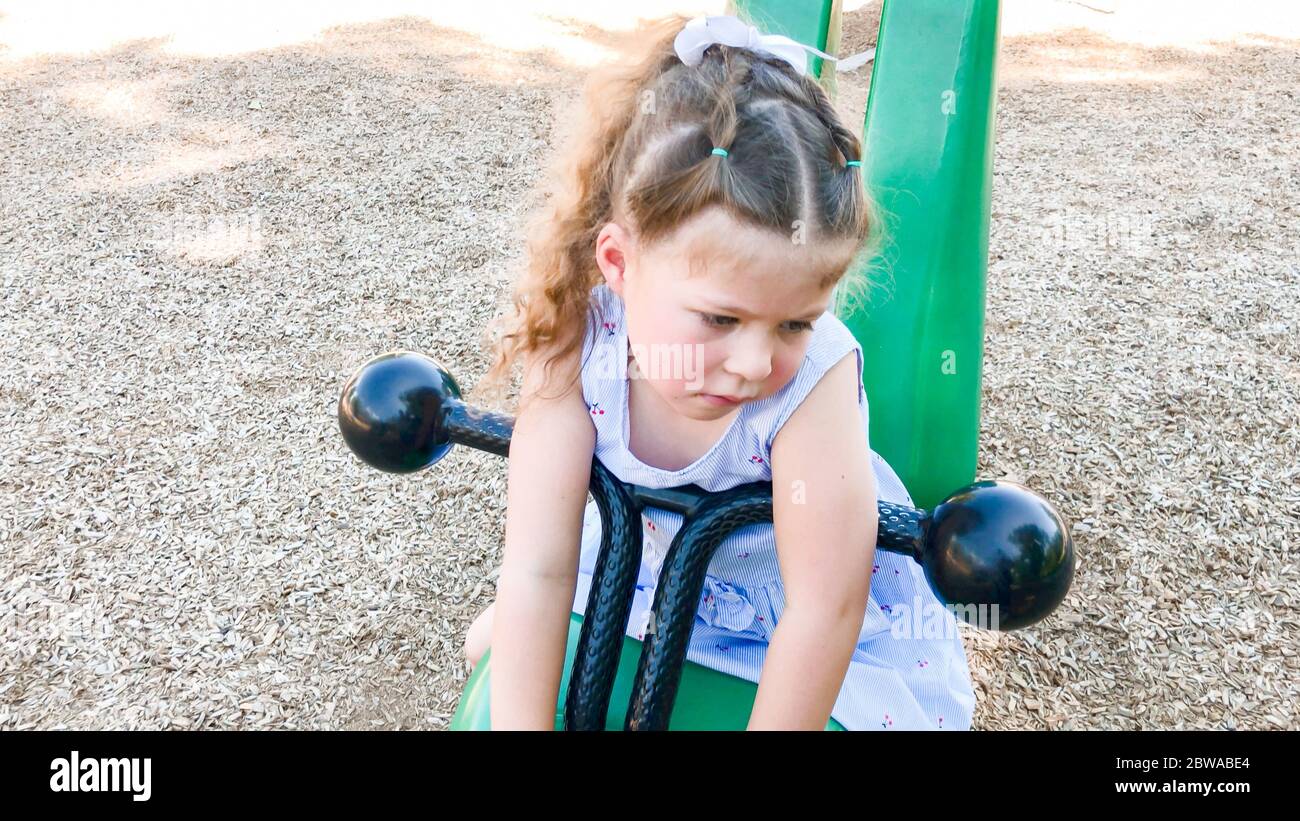Little girl playing at the kids playground on the hot summer day Stock ...