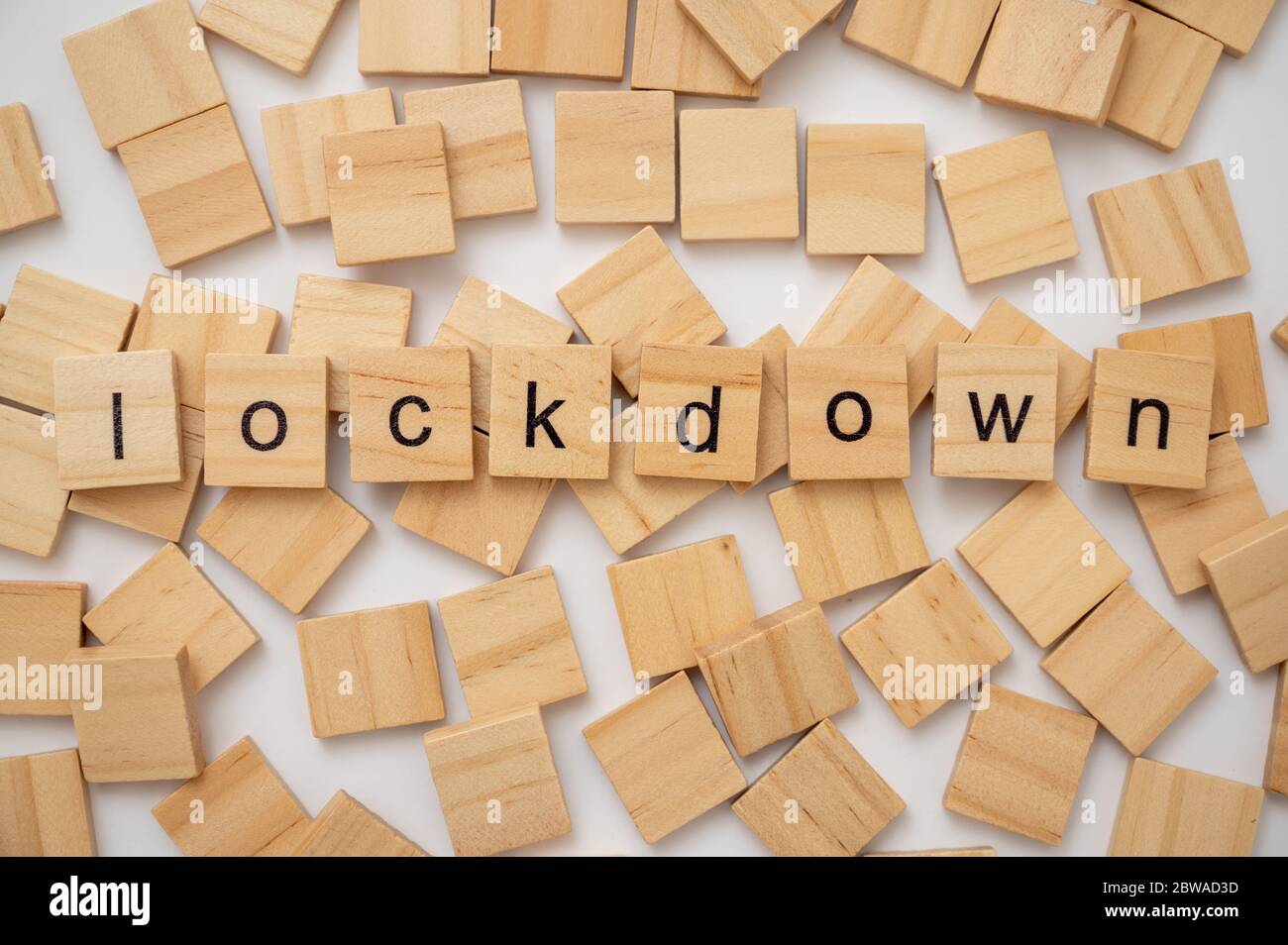 Wooden letter tiles spelling the word LOCKDOWN Stock Photo
