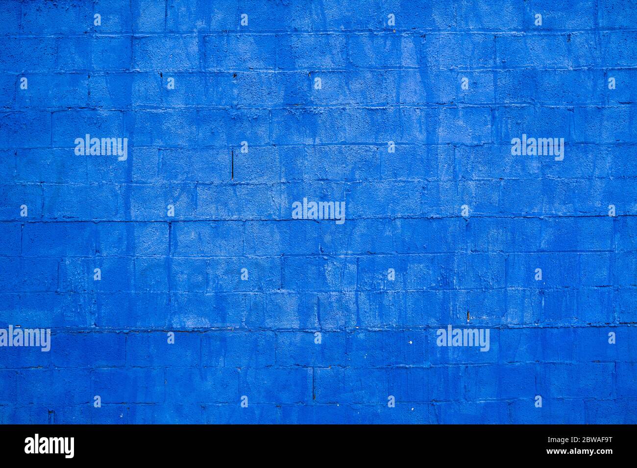 Concrete block wall texture painted blue Stock Photo
