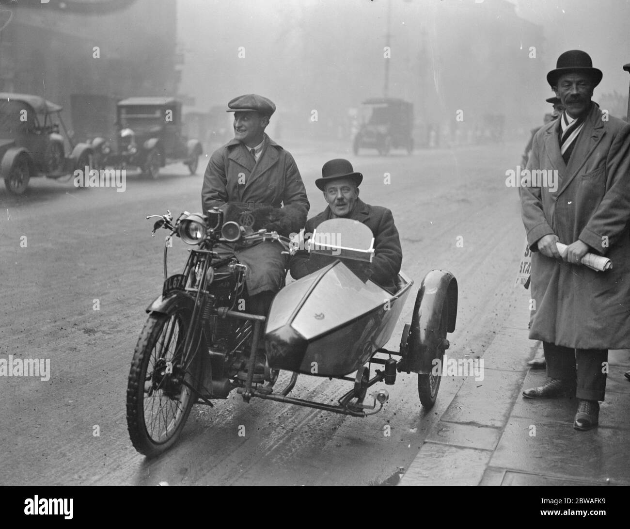 Tram and bus strike inquiry at law courts Mr R N Baldock ( Tramway workers union ) arrives by sidecar 22 March 1924 Stock Photo