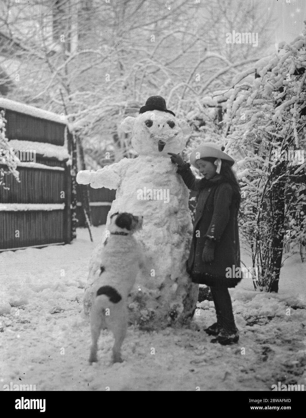 Phyllis and snowman Stock Photo