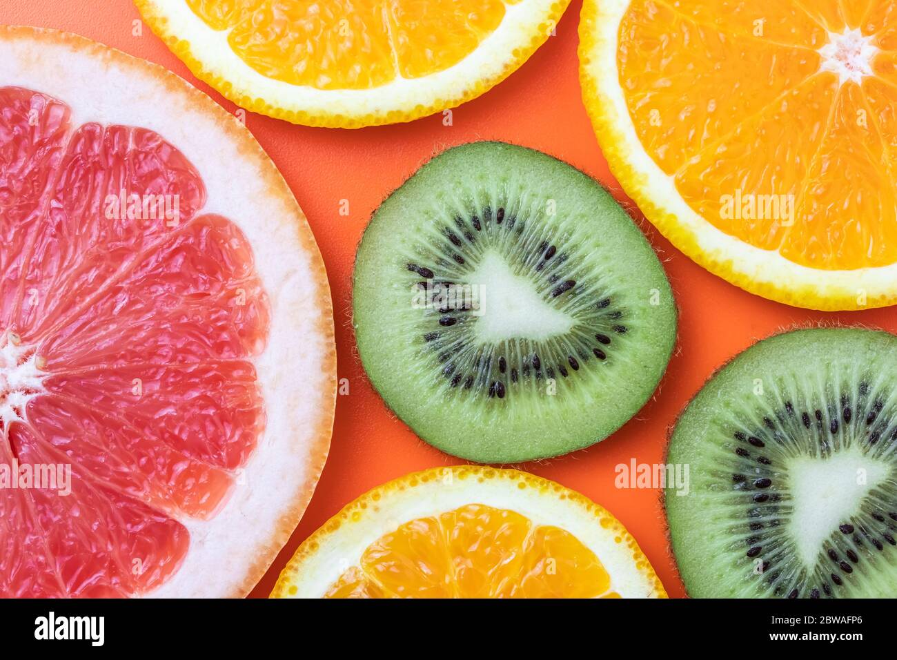 Fresh fruit background, citrus colorful pattern. Slice of kiwi, orange and  grapefruit on bright background. Exotic tropical fruits close-up Stock  Photo - Alamy