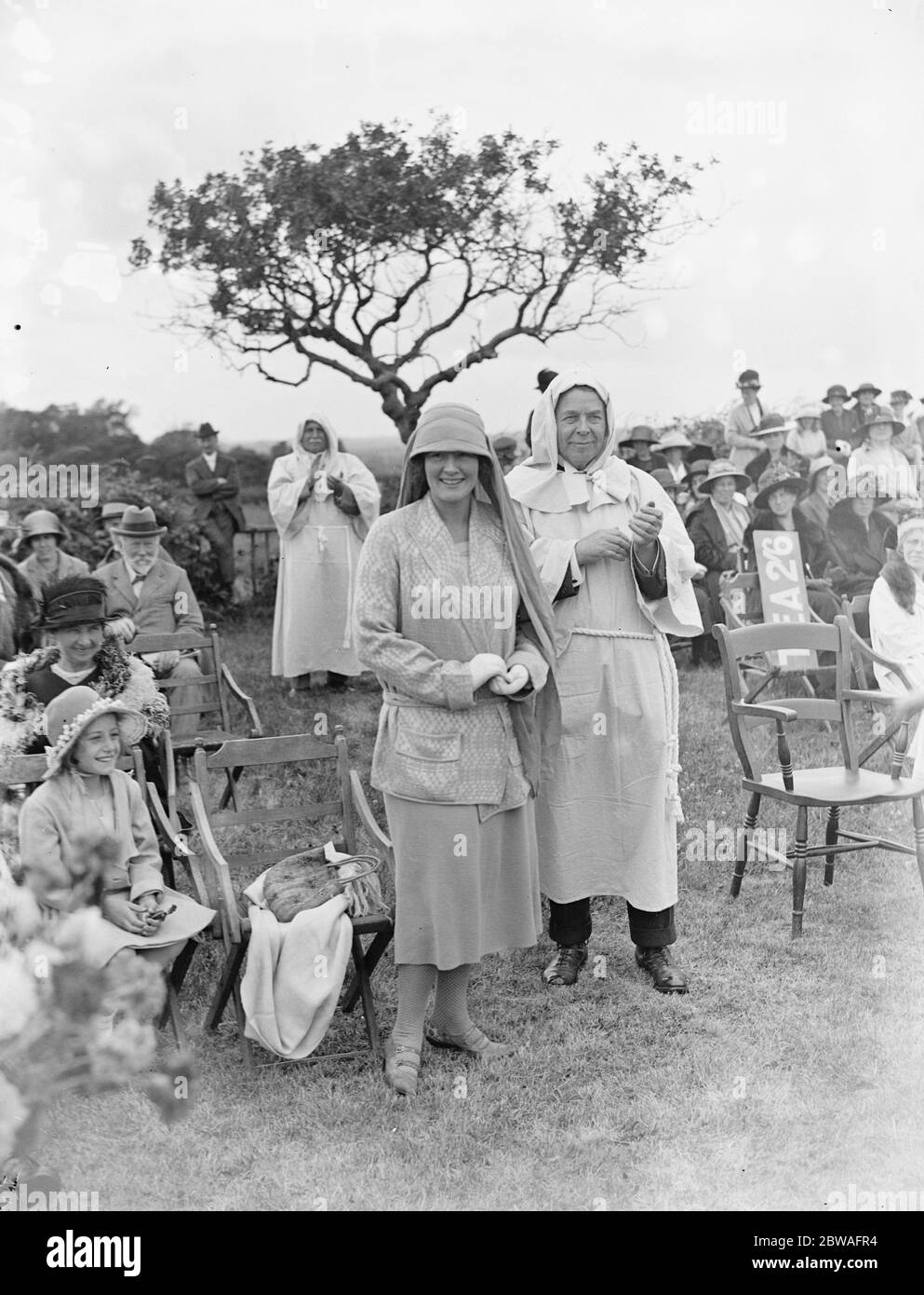 Mrs McArthur Holman , daughter of Sir Jesse and Lady Boot at the Plantagenet Fair with Dr Kimmins ( as a jovial monk ) , held at the Chailey Heritage Craft School , East Sussex . 19 July 1923 Stock Photo