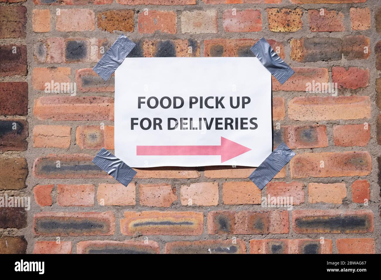 Food bank pick up direction arrow sign Stock Photo Alamy