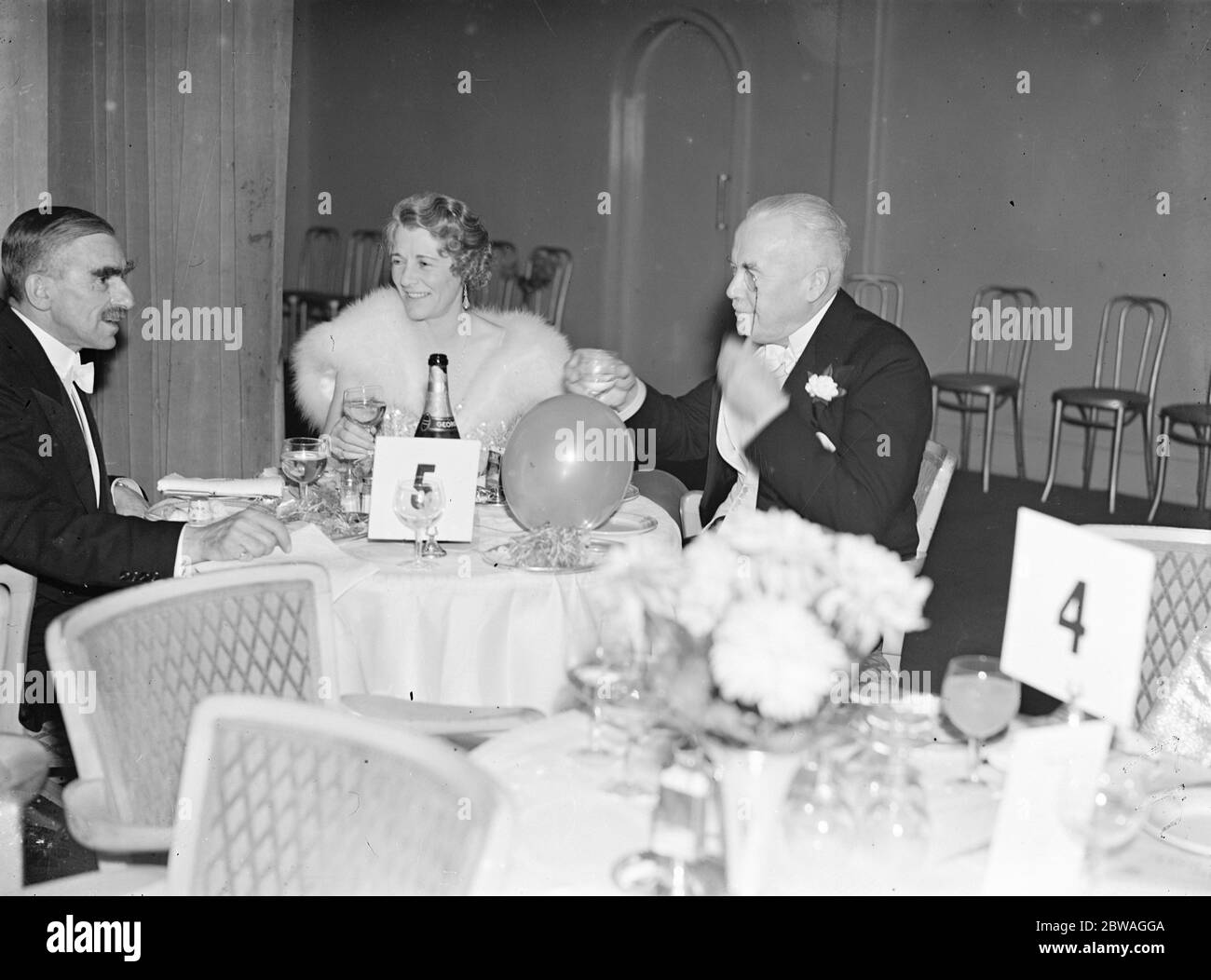 At the Golf Ball held at Grosvenor House , London , in aid of the St Mary ' s Hospital Extension Appeal Fund ; Mr EF Bisgood , Captain of the Royal Mid - Surrey Golf Club , with Major Collis Brown ( Secretary of the Royal Mid - Surrey ) and Mrs Collis Brown . 1938 Stock Photo