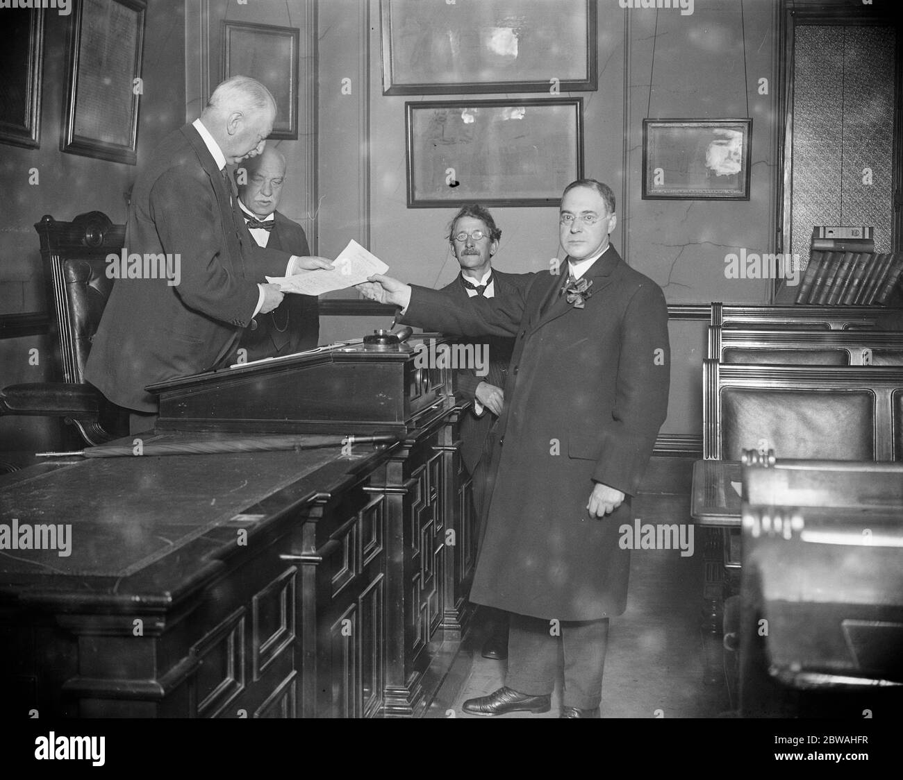 General Election , October 1924 , Nominations Mr A H Wolf , Labour candidate for Abbey division , Westminster , hands in his papers to the returning officer , Mr Edgar Horne 19 October 1924 Stock Photo