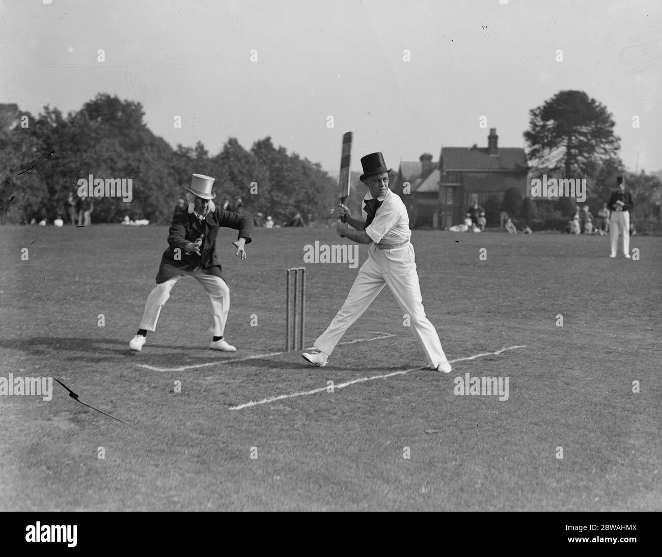 Top hats and side whiskers were worn by players in an old time cricket match between Tonbridge and Tunbridge Wells on the village green at Southborough 13 September 1931 Stock Photo