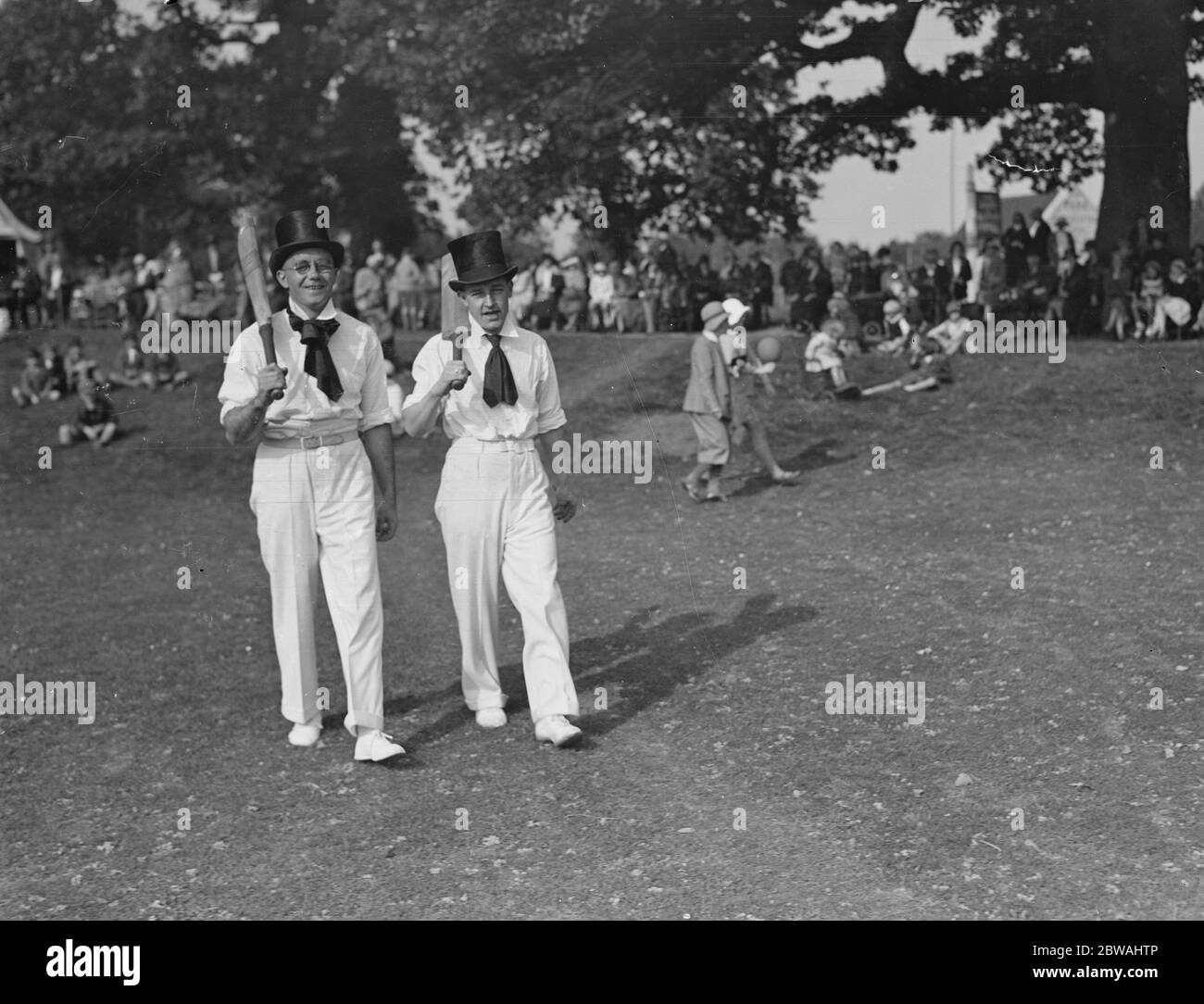 Top hats and side whiskers were worn by players in an old time cricket match between Tonbridge and Tunbridge Wells on the village green at Southborough 13 September 1931 Stock Photo