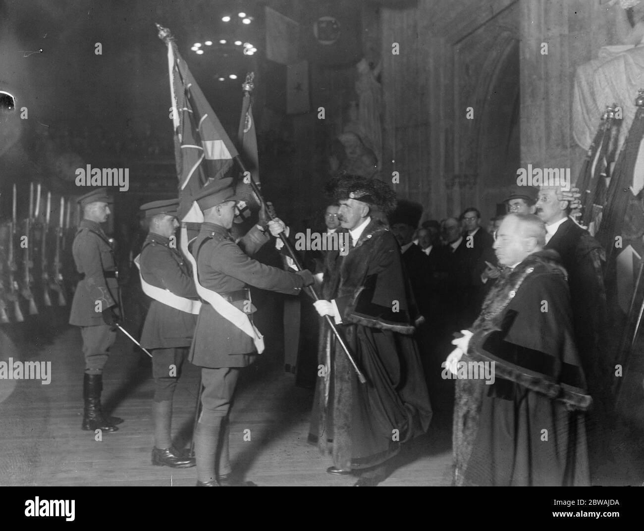 Giving back the colours of the first Battalion , City of London Royal Fusiliers which have been in the city '' s keeping for the last four years . The Lord Mayor presenting the colours which are to be taken to Germany 29 November 1918 Stock Photo