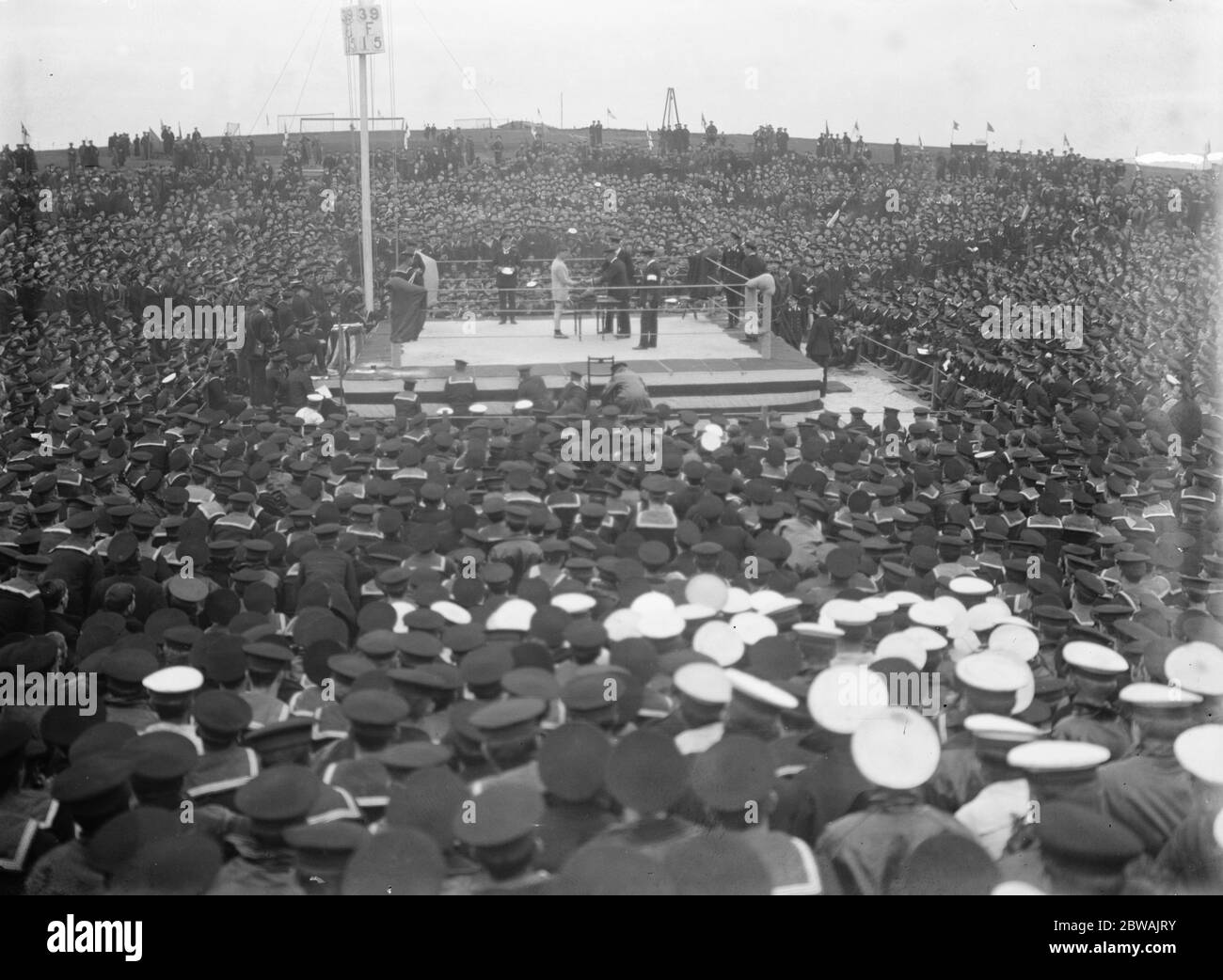 1916 Finals of the Grand Fleet boxing competitions held on the island of Flotta, by Scapa Flow, where the Grand Fleet was then stationed. The boxing ring was jury-built from spars, ropes, canvas and planking scavenged from various ships by a couple of enterprising Chief Petty Officers, names now not known. Stock Photo