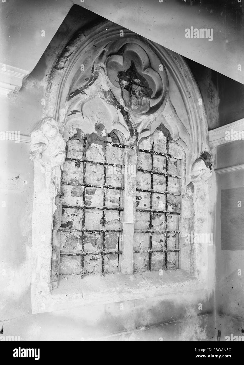 Remarkable find of old stained glass at Chelsea Old Church An old window at Chelsea Old Church that has been blocked for nearly 300 years has been opened . Hidden behind the plaster the remains of an early 14th century stained glass window . This discovery is regarded by antiquaries as one of the very highest importance . The picture shows the old window after it had been opened and the stained glass removed Stock Photo