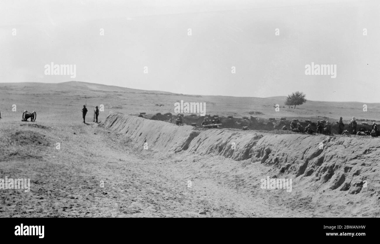 Troops stand by their trenches with soil built embankment defences No caption information available. Stock Photo