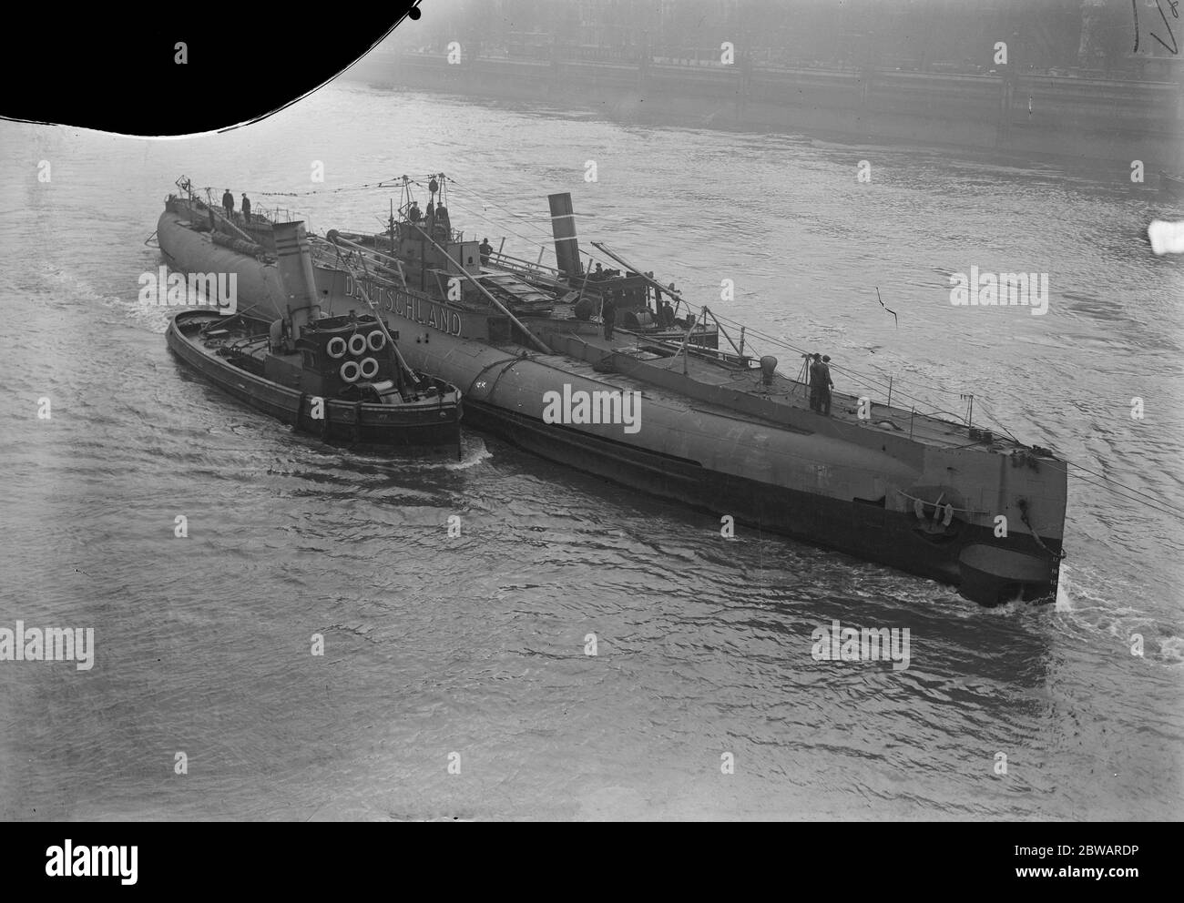 The Deutschland Leaves London The Deutschland , Germany ' s commercial Submarine which has been on exhibition off the Embankment for some time , leaving London , on a tour round the coast 18 May 1920 Stock Photo