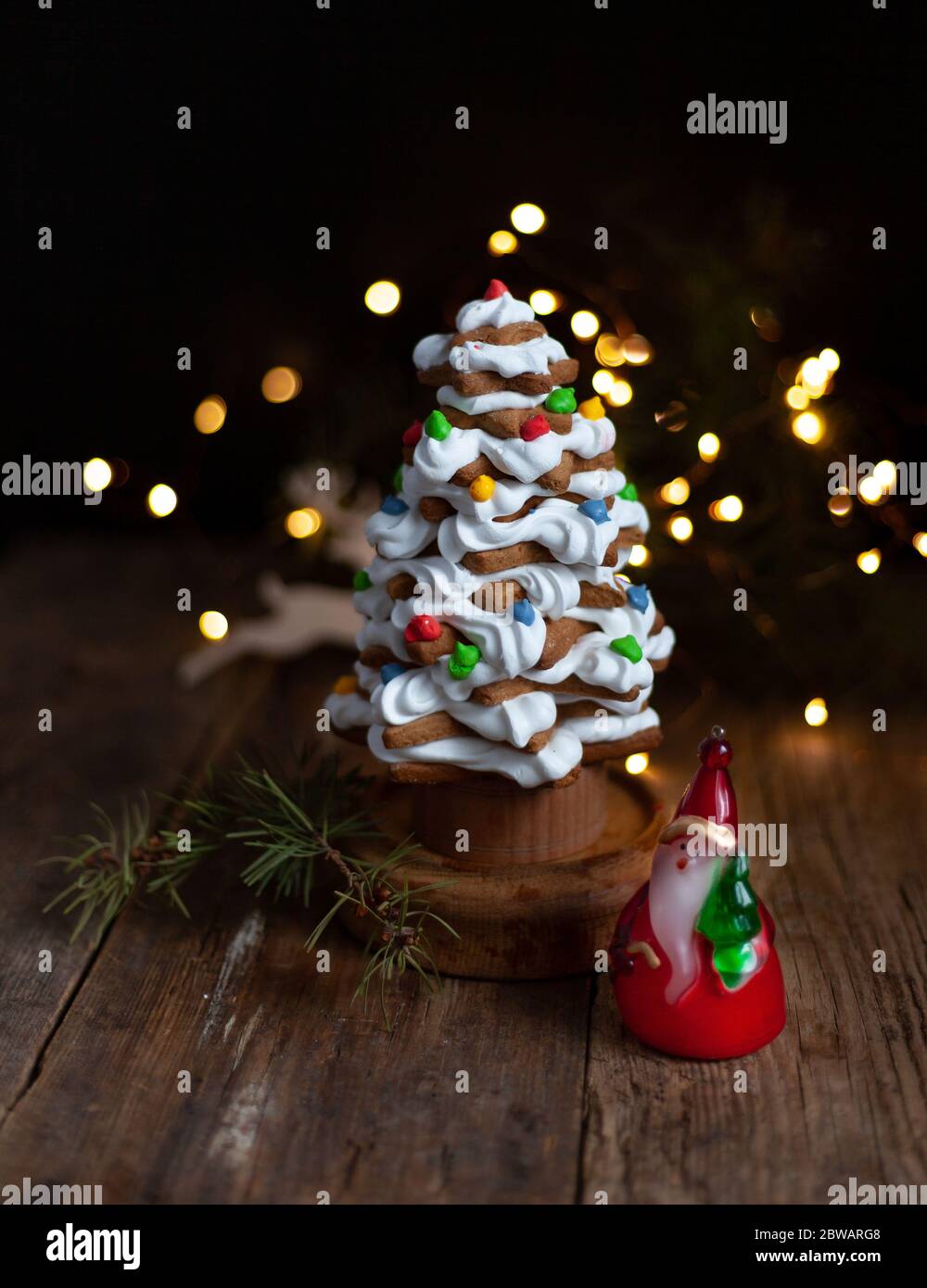 Baked gingerbread christmas tree on wooden background. Close-up Stock ...