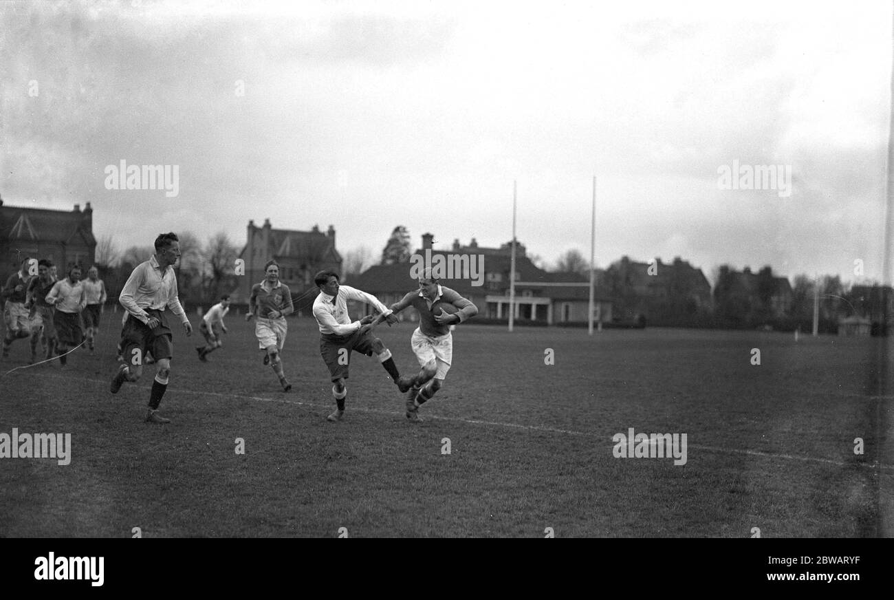 The Old Merchant Taylors versus London Irish rugby match at Teddington . ( The last match on the former 's present ground , next season they change to Croxley Green ) . J D Gibbon ( OMT ) and J M Thomson ( London Irish ) in a tackle . 10 April 1937 Stock Photo
