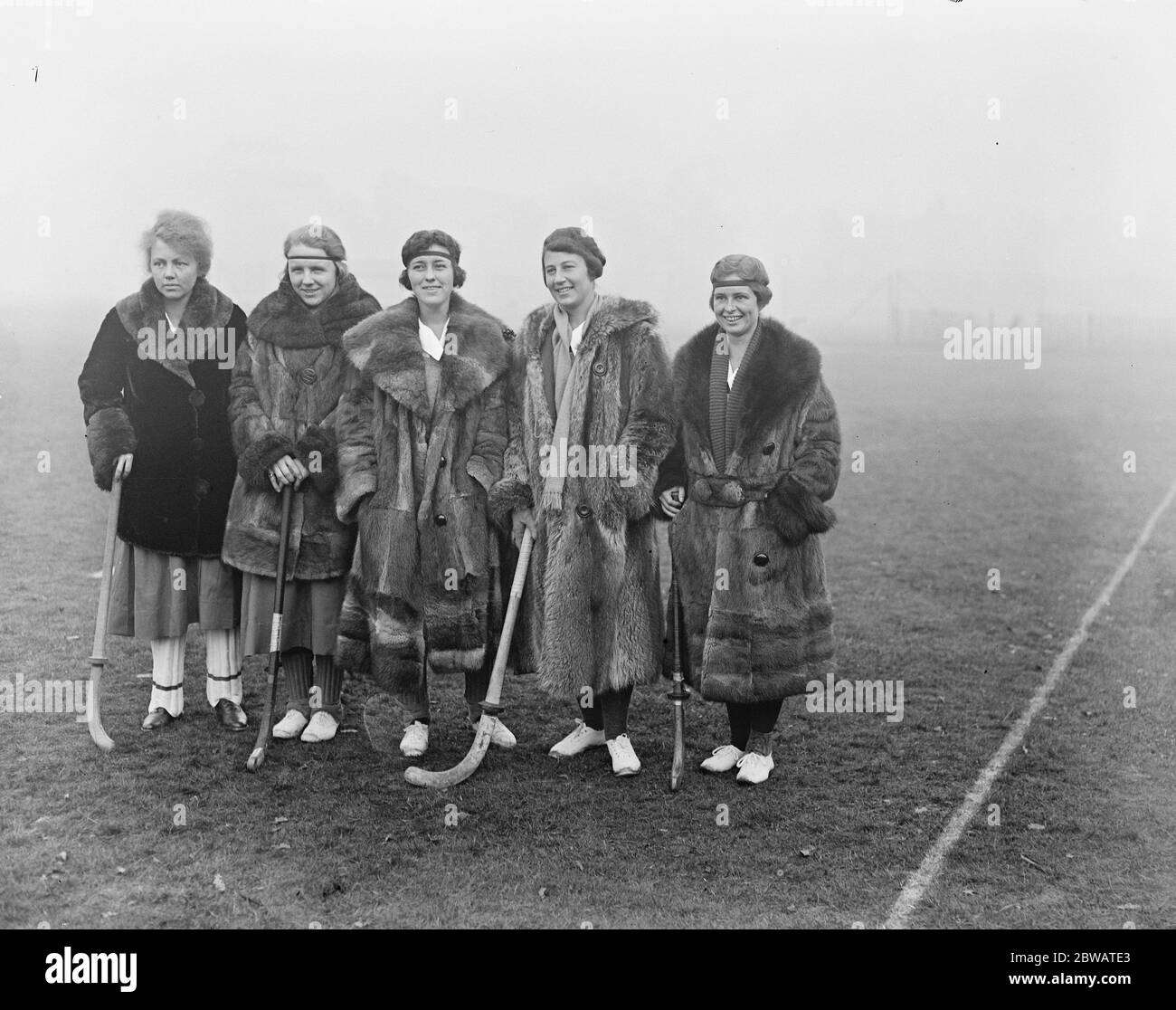 1920 - The first American women's field hockey team, All-Philadelphia team competed internationally. Their application to the 1920 Olympics in Antwerp was denied, but they played in an English tournament and lost both games America ' s lady ' s hockey players first match in England . Five members of the American team photographed before the match wearing magnificent fur coats . Left to right Misses Fioley , F Ross , A Bergen , E CHester the Captain ) and E Weiner 4 November 1920 Stock Photo