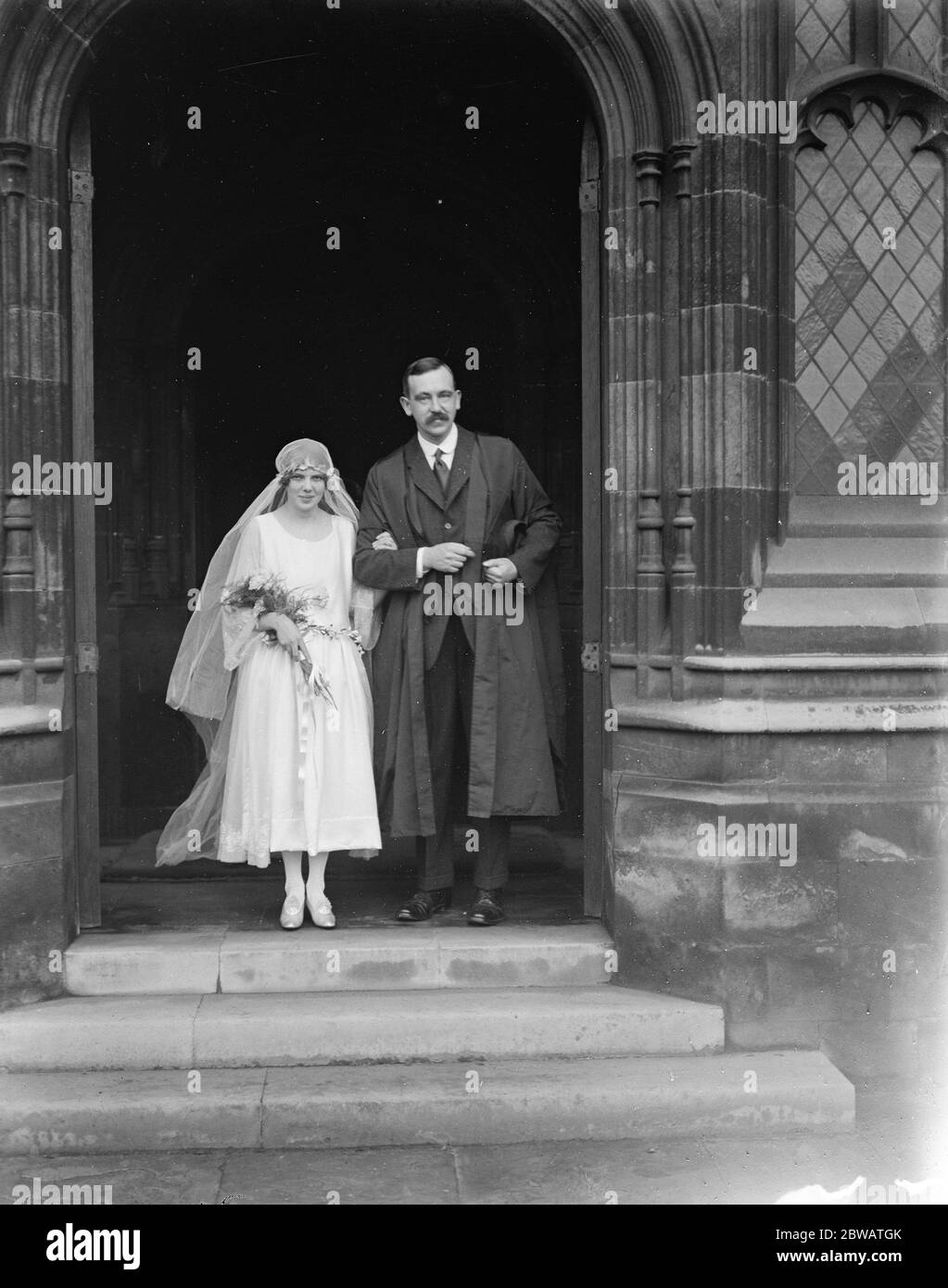 Wedding Miss Eileen Mary Rutherford the 20 year old daughter of Sir Ernest Rutherford Cavendish , Professor of physics at Cambridge University and Mr Ralph Howard Fowler a brilliant young mathmatical don were married in Trinity College Chapel Cambridge The Bride and Bridegroom leaving after the ceremony 6 December 1921 Stock Photo