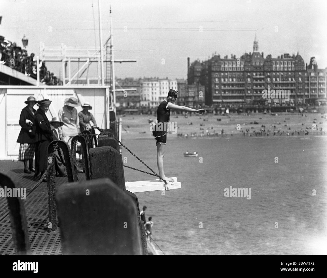 Diving off the pier during the Whitsun holiday at Brighton . 1920 Stock Photo