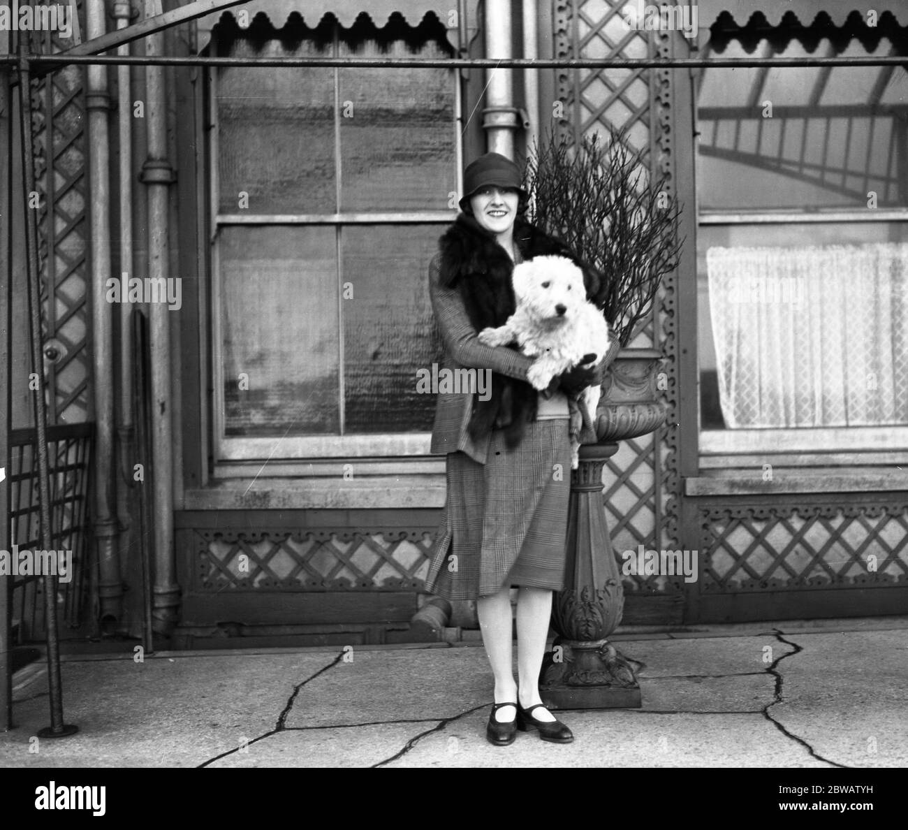 The actress , Miss Phyllis Titmuss pictured with her pet dog in Brighton , Sussex . 1927 Stock Photo