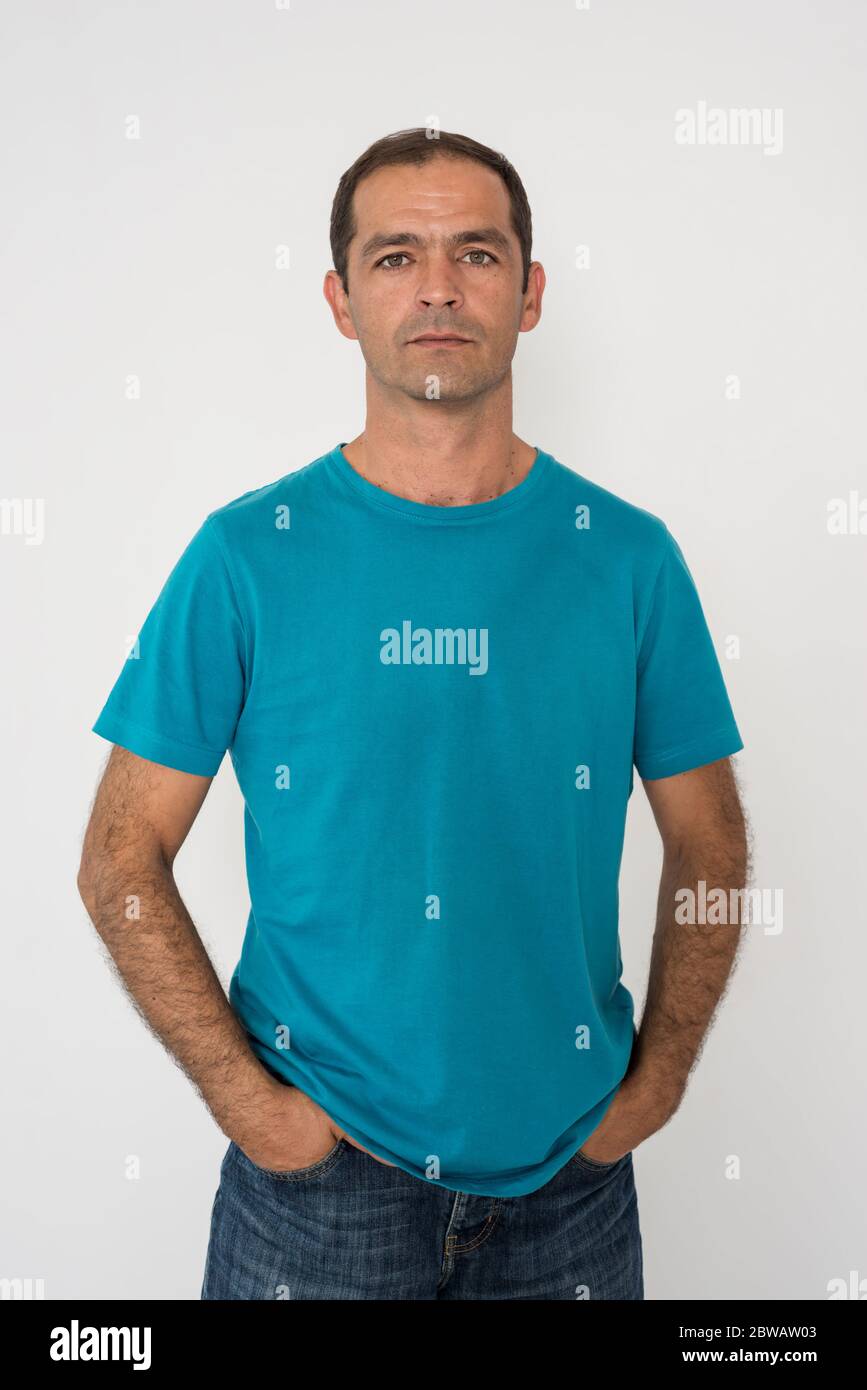 Portrait of a dark-haired man in a blue T-shirt Stock Photo