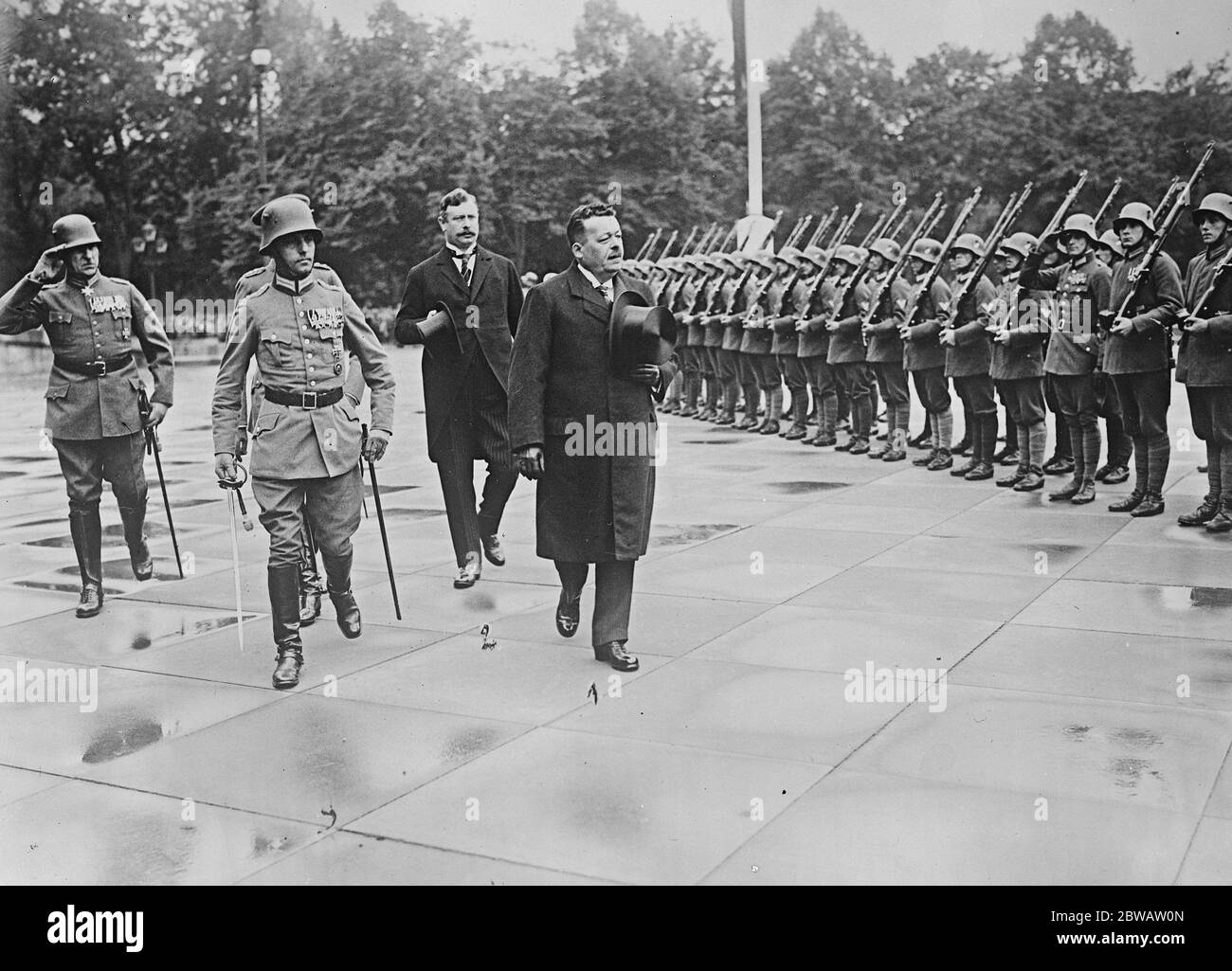Germany celebrated the third year of the German Republic . President Ebert and Chancellor Wirth inspecting the military guard of honour in Berlin . 14 August 1922 Stock Photo