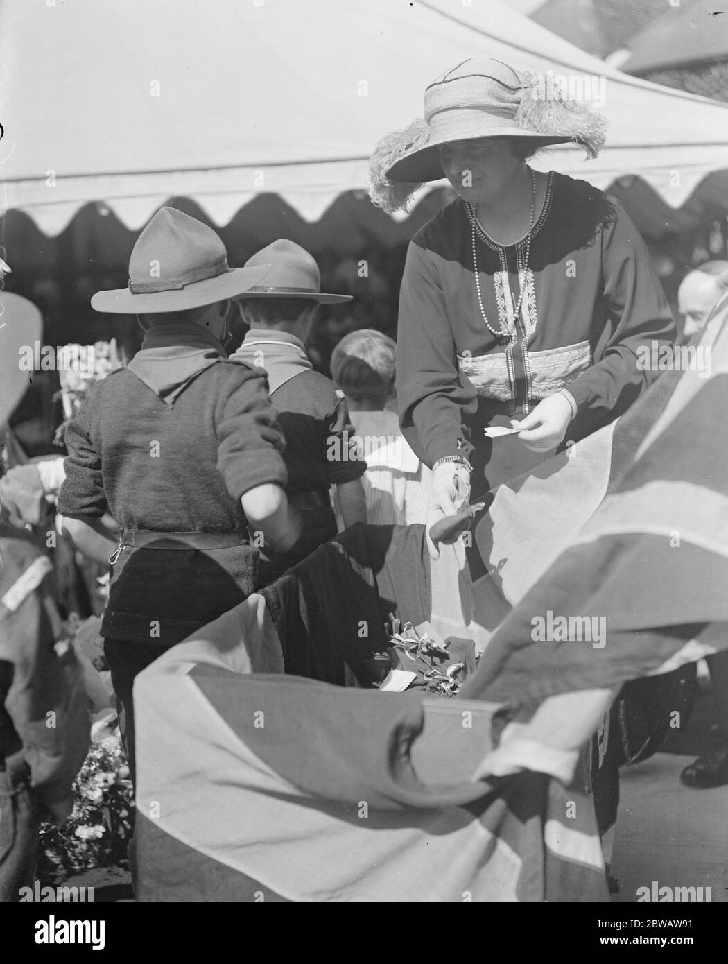 Admiral Sturdee opens new wing of Nelson Hospital at Merton Park . Lady Hood who desputised for Lady Sturdee receiving purses from children which were deposited in a sea chest of historic interest covered with the Union Jack . 27 May 1922 Stock Photo