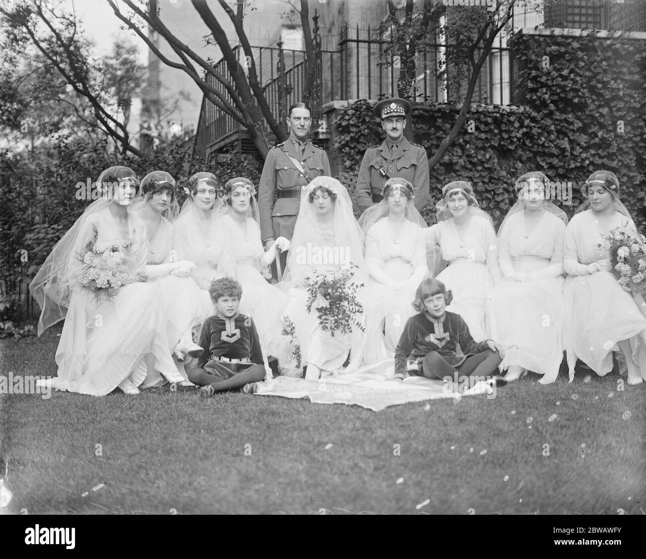 Wedding of the Hon Clarissa Tennant and Captain Adrian Bethall at St Margarets Church Westminster A group of the bridesmaids first row left to right The bridegroom ( CAptain Adrian Bethell ) and his best man Lord Cochran 2 nd row left to right Miss Tennant , Miss Farquharson , Miss Boyd , Lady Mary Charteris , The Bride , Miss Bethell , Miss O ' Wyndham , Miss L Adean 3rd row left to right , The Viscount Carlow Hon S Tennet and the pages of honour 1916 Stock Photo