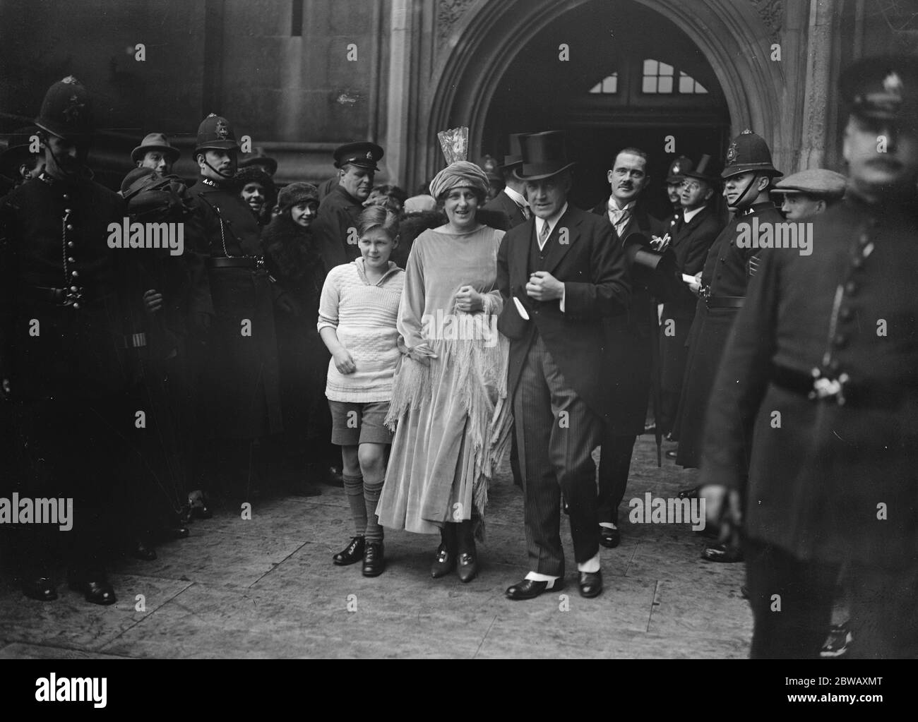 Lady Scott , widow of the Antarctic Explorer , was married to Lieut Com Edward Hilton Young , DSO , DSC , MP , at the Crypt Chapel , House of Commons . Lady Scott 's son Peter is seen with his mother . 3 March 1922 Stock Photo