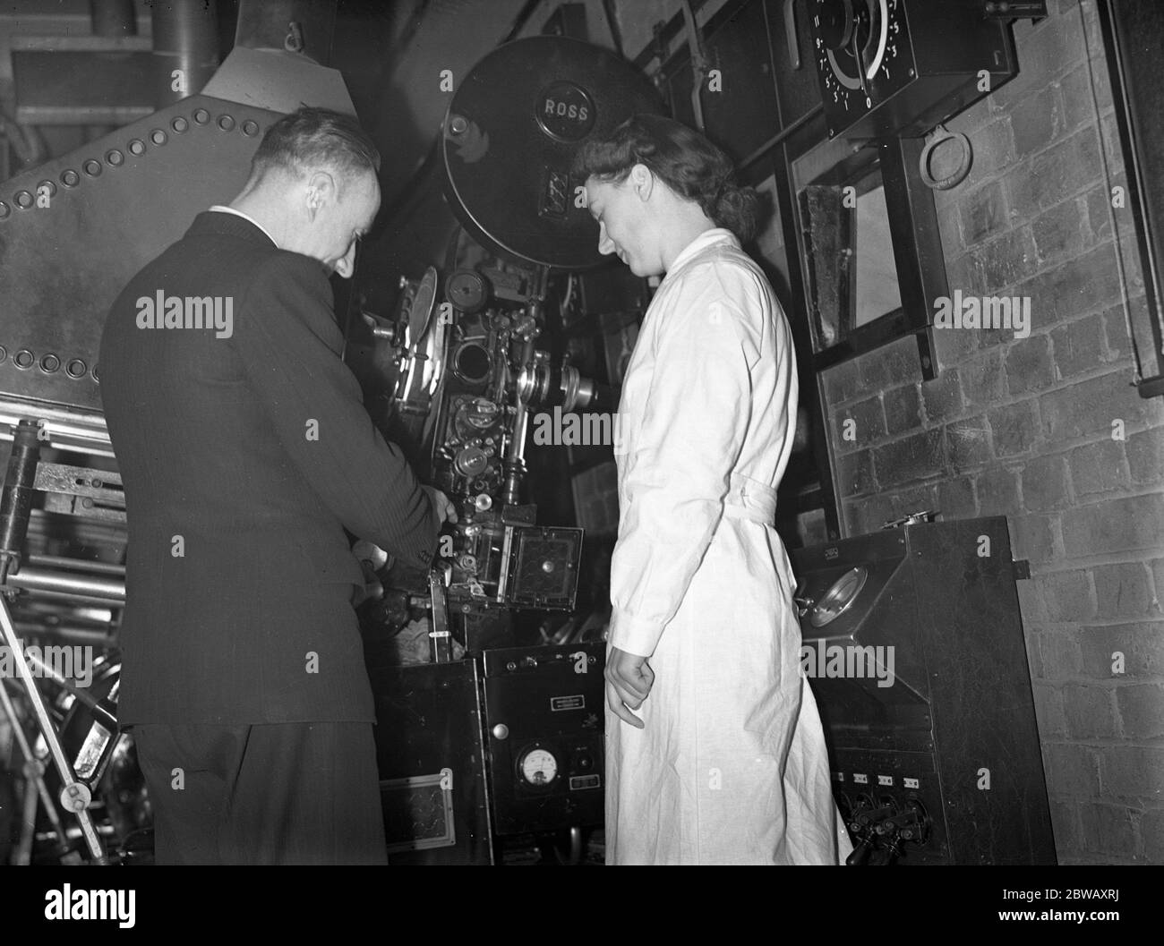 The girl cinema operator takes up her new occupation at the Granada Cinema , East Ham , London . 13 January 1940 Stock Photo