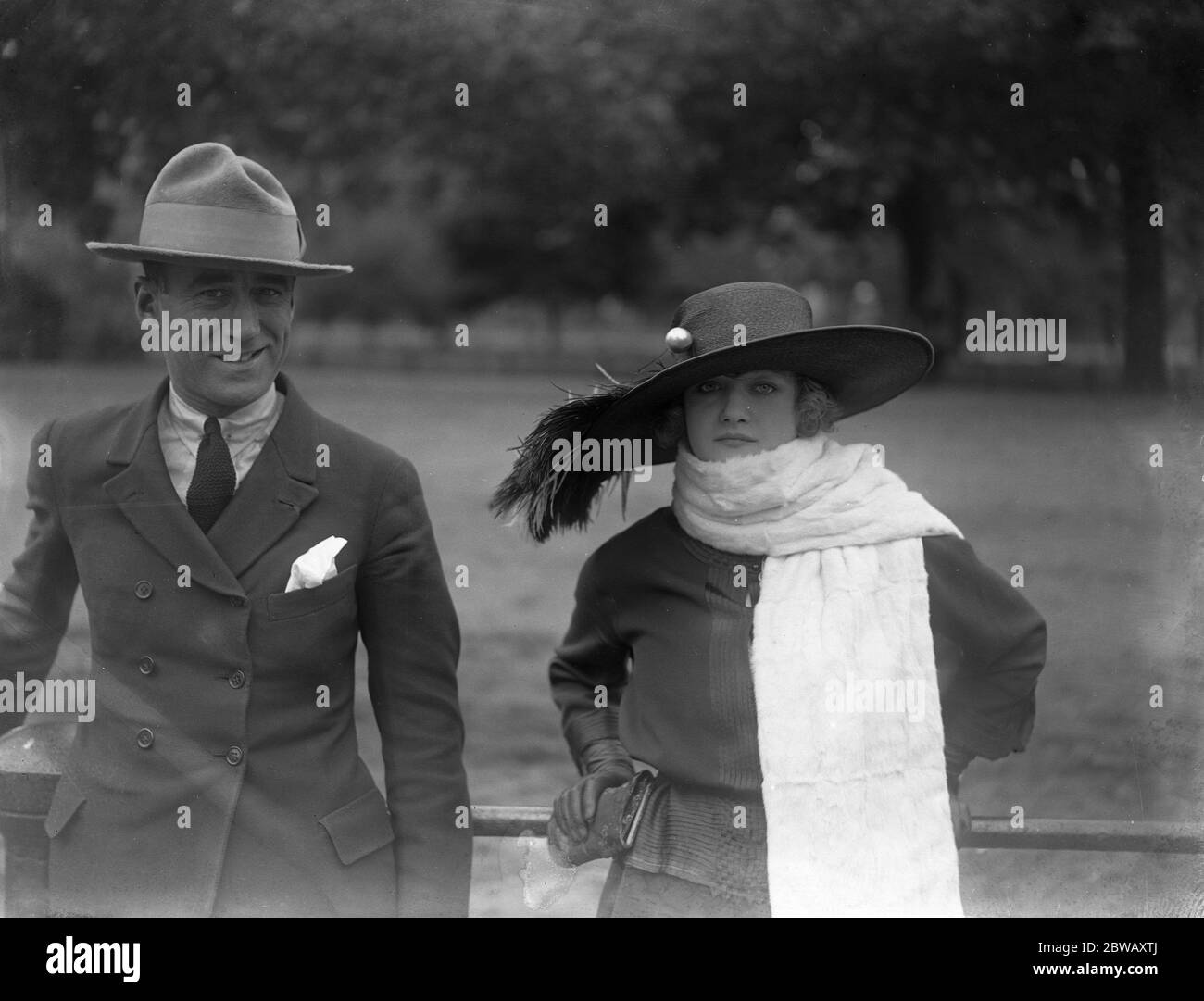 The English cinema actress , who has won fame in Paris - Mme Peletier and her husband in London ' s Hyde Park . 1921 Stock Photo