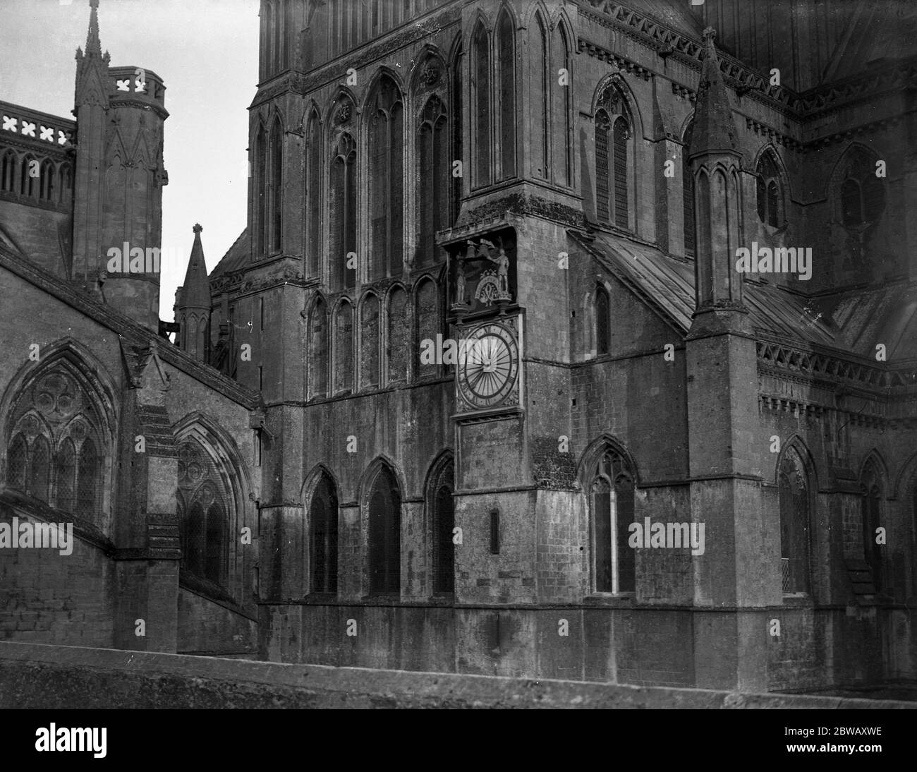 Clock on the wall of Wells Cathedral , Somerset . Stock Photo