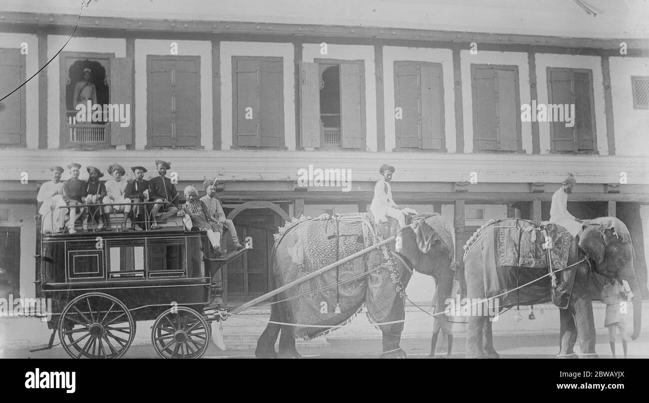 Quaint combination of transport methods . Will the Prince of Wales see this in India ? The elephants are attached to an ordinary station bus to convey sightseers to important Indian ceremonies . 6 December 1921 Stock Photo