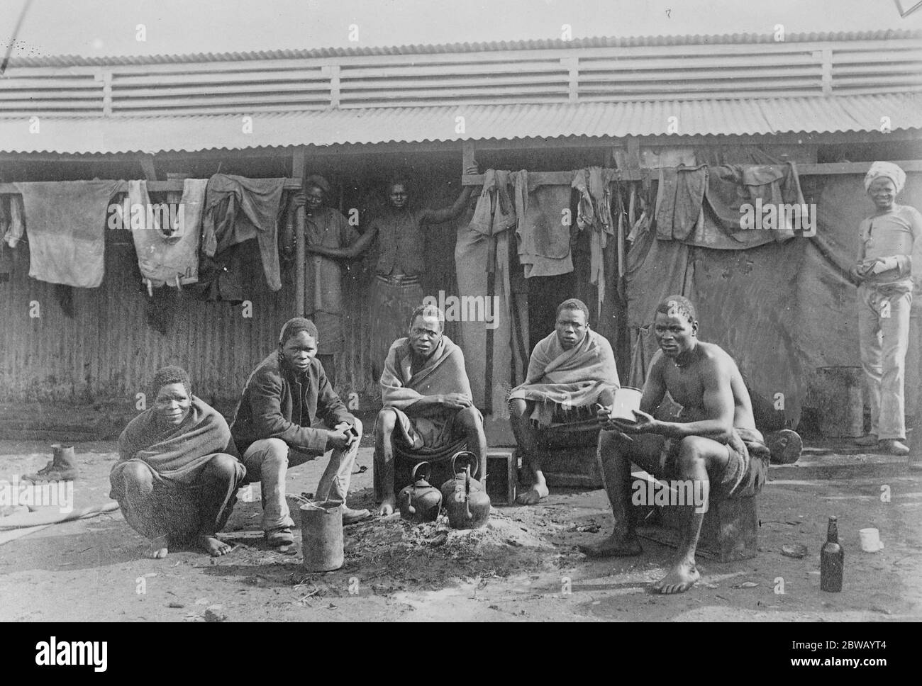 The Rand Strike in the Witwatersrand region of South Africa One of the worst features of the rand strike is said to be the frequent attacks by the strikers upon unoffending natives , several of whom it is reported have been killed . Native mine workers are seen here in the compound 10 March 1922 Stock Photo