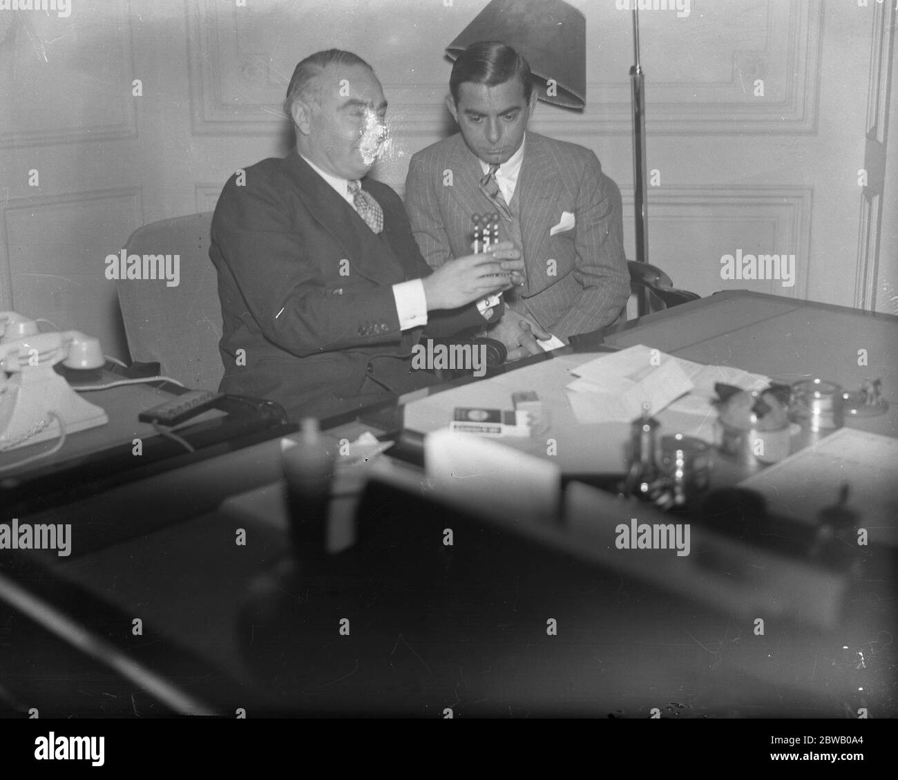 American entertainer , Eddie Cantor and Mr Hore Belisha discussing traffic problems during the filmstars visit to the Ministry of Transport 7th January 1935 Stock Photo