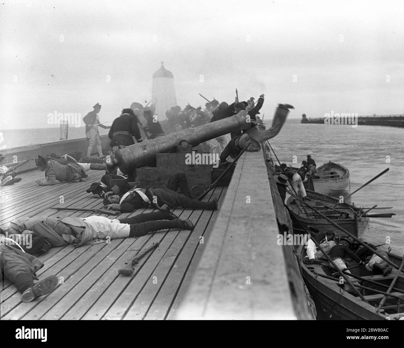 Re - shooting the ' Nelson ' film that was destroyed by fire . Shooting an action scene at the seafront at Littlehampton , Sussex . Storming the Mole . 14 July 1918 Stock Photo