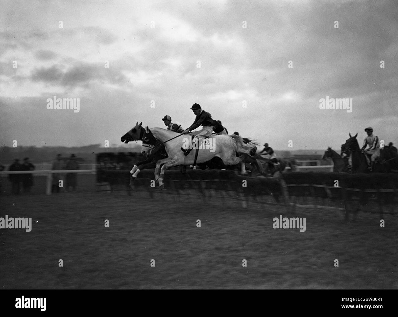Over the jumps at Newbury racecourse , ' Henri's Choice ' ( once broke its neck ) no. 23 , winner of the Berkshire Handicap Hurdle . 2 December 1936 Stock Photo