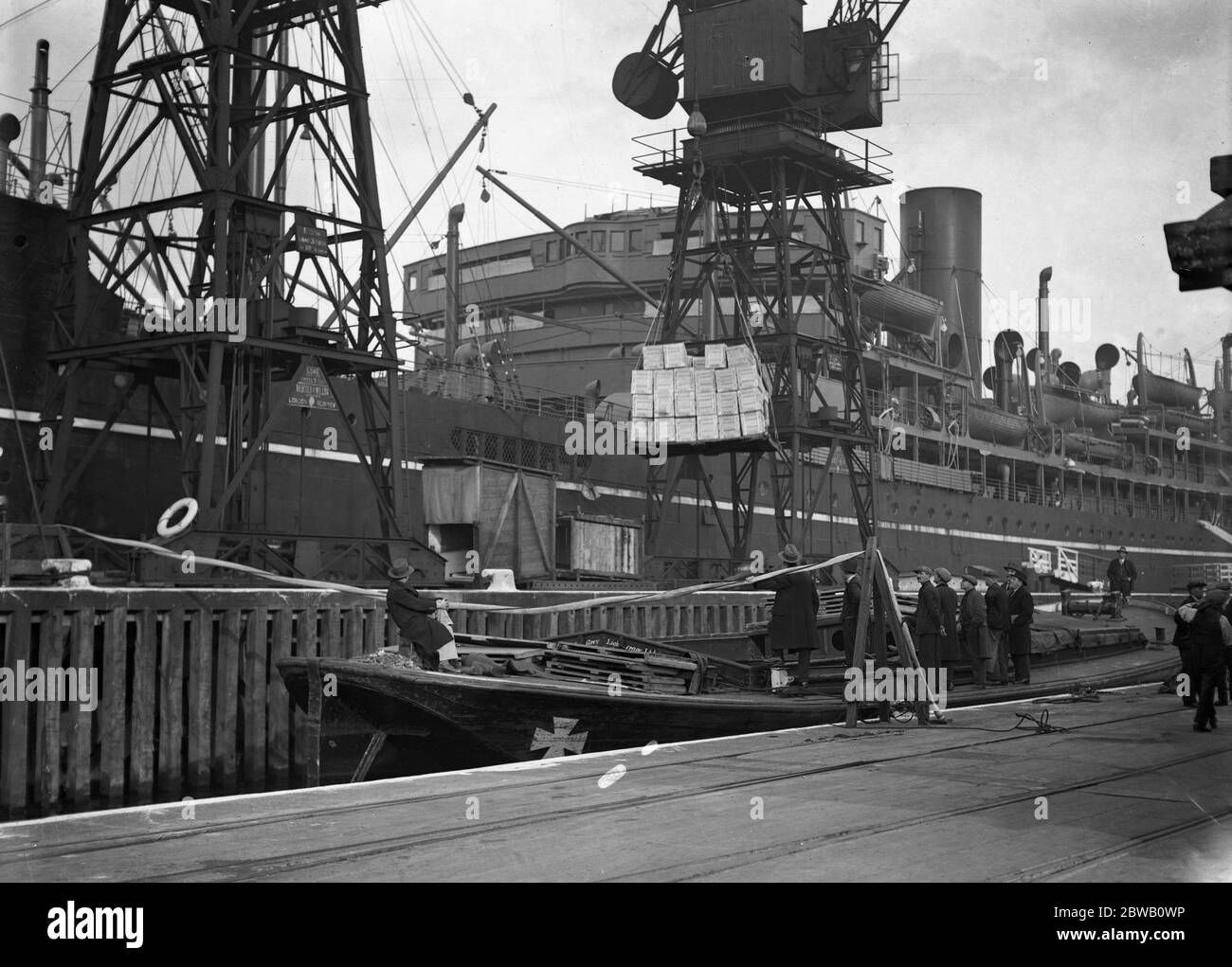 Unloading a cargo of 7,000,000 Australian eggs from the liner , ' Barradine ' at the King George V dock . They have been brought over in refrigerator space from Sydney , Freemantle , Brisbane , Melbourne and Adelaide in Australia . 5 November 1931 Stock Photo