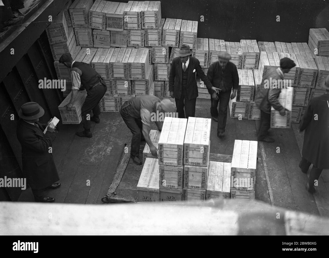 Unloading a cargo of 7,000,000 Australian eggs from the liner , ' Barradine ' at the King George V dock . They have been brought over in refrigerator space from Sydney , Freemantle , Brisbane , Melbourne and Adelaide in Australia . 5 November 1931 Stock Photo