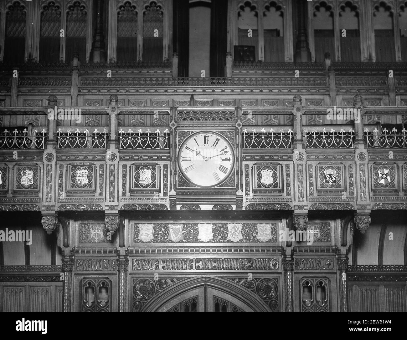 The Commons Roll of Honour , Memorial Chamber The memory of the nineteen members of the House of Commons who fell in the War is being perpetuated in the debating chamber itself , by means of heraldic shields placed at each side of the clock . the shields seen in the photgraph from left to right are Captain the Hon H T Cawley , Mr W G C Gladstone , The Hon O ' Neil The Hon Agar Roberts 11 February 1921 Stock Photo