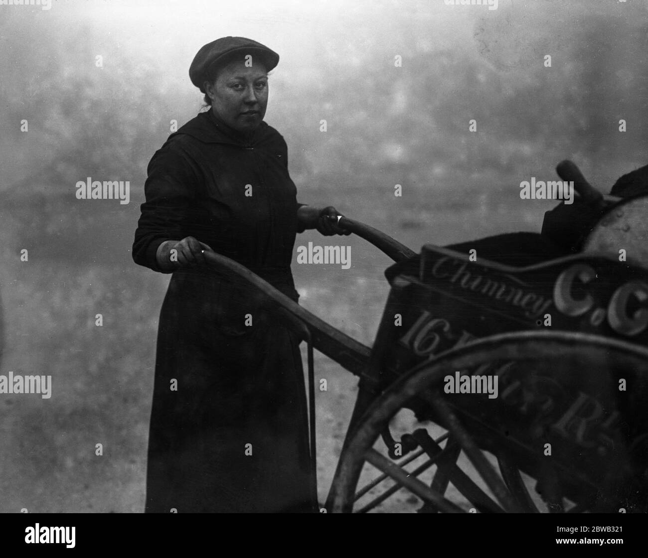 The war has produced this lady chimney sweep in Camberwell , London . She is Mr Could 's daughter , Mrs Violet Smith , whose husband joined the army in the early days of the war and she now assists her father on his daily round . 1914 - 1918 Stock Photo