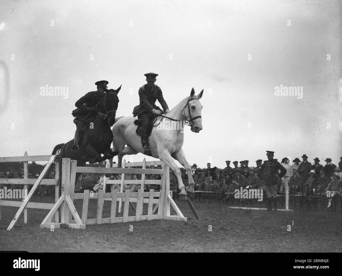 Oxford versus Cambridge in the Officer Training Corps tournament at Cambridge . 2nd Lieutenant W G Carr and Sergent A F Sinclair in the half section jumping . 12 June 1923 Stock Photo
