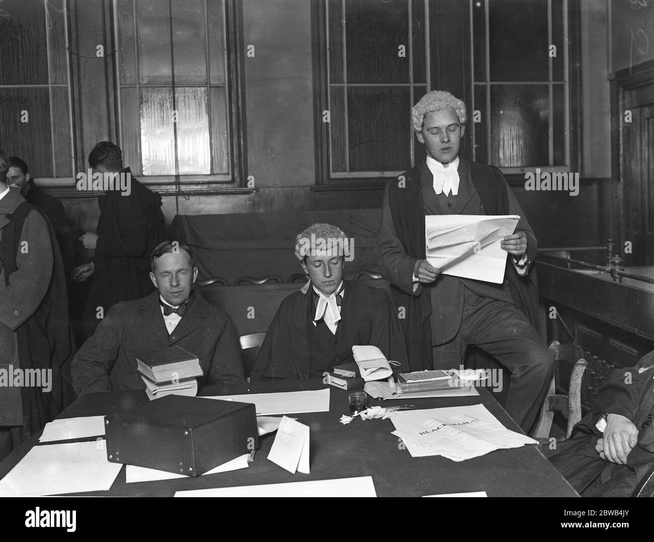 Cambridge undergraduates ' Mock Trial ' at Alexandria Hall - ' Rex versus Harold Wendover ' Counsel for the Crown ( Mr R S Nettleton , King ' s ) makes his conviction speech when ' Beaver ' , Foreman of the jury , rises to ask a question . 28 November 1922 Stock Photo