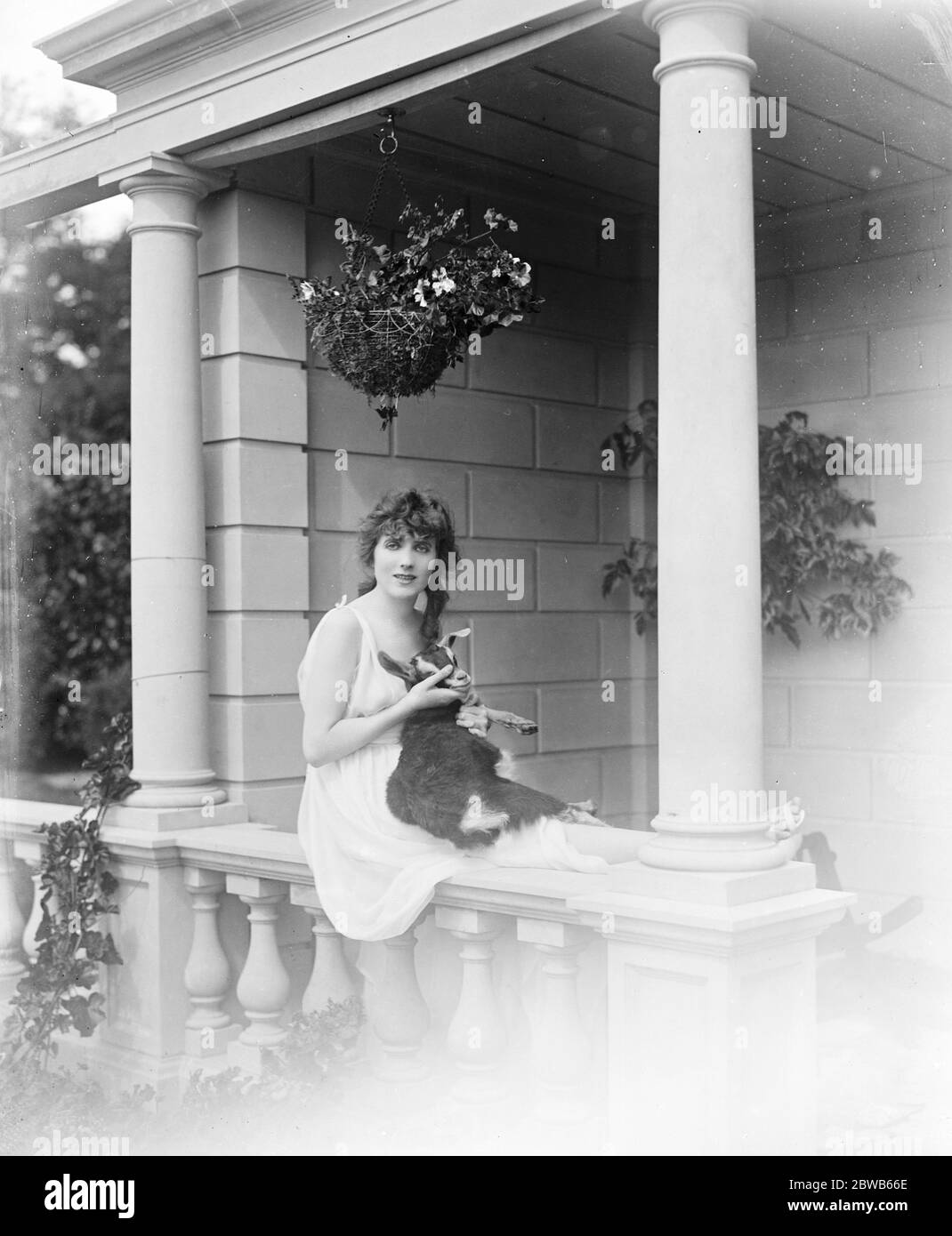 Mlle Gina Palerme , French actress and singer with her pet goat . A camera study . 1919 Stock Photo