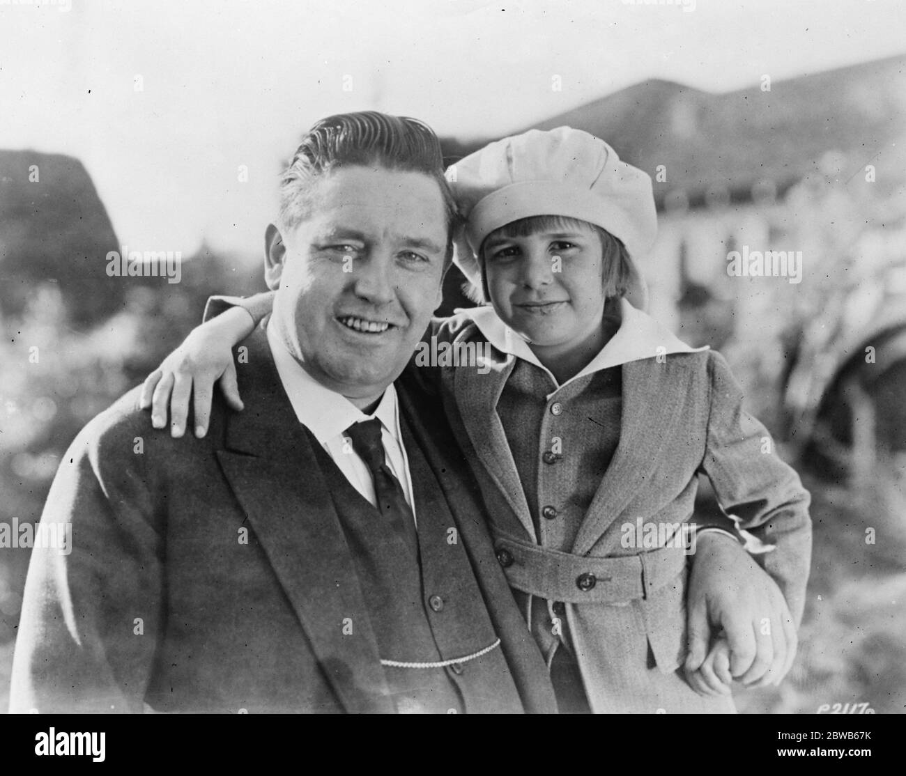 Famous tenor to return to english stage after absence of ten years Mr John McCormack , who has returned to the English stage after ten years . He is to appear at the Queen ' s Hall on October 5 . Pictured here with Jackie Coogan 19 September 1924 Stock Photo
