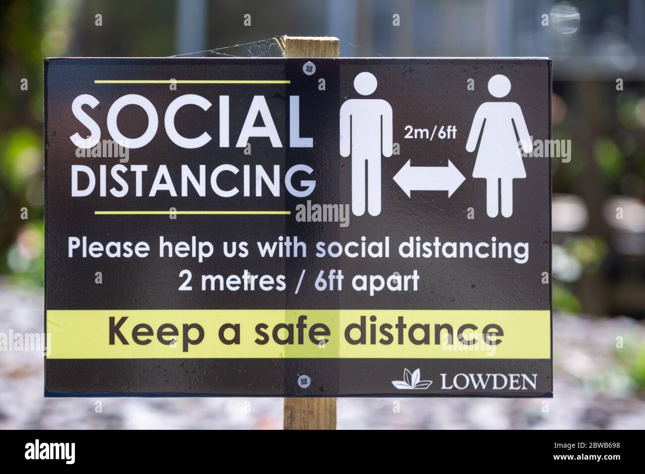 Social Distancing 2 metres apart information notice sign in Lowden garden centre shop, Wiltshire, England, UK, May 2020 Stock Photo