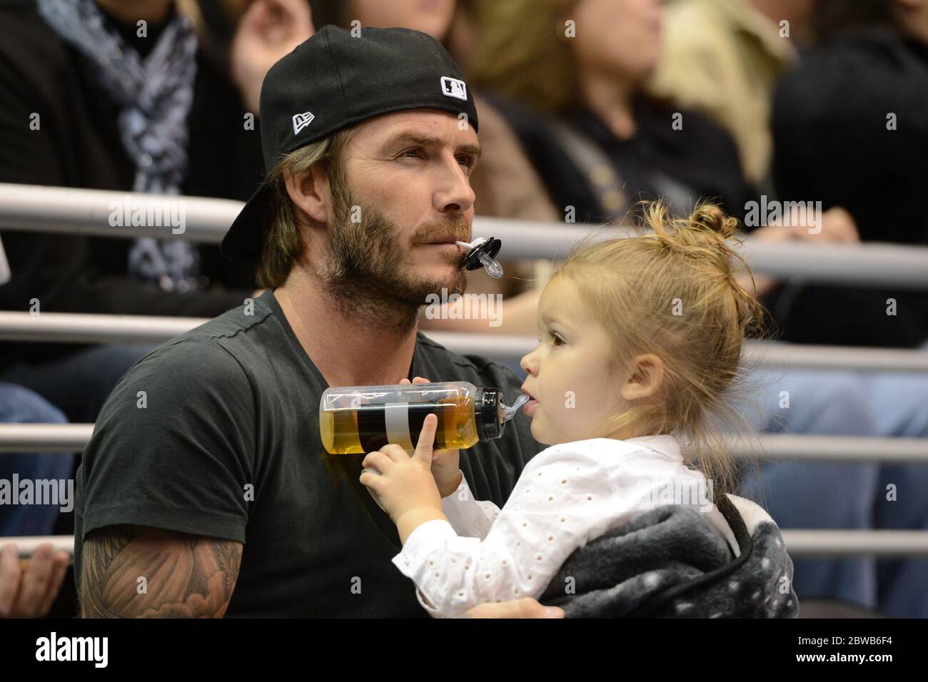 21 October 2013 David Beckham and daughter Harper watch the Los Angeles  Kings ice hockey team play Calgary Flames at the Staples Center, Los  Angeles, CA and was joined by Brooklyn and
