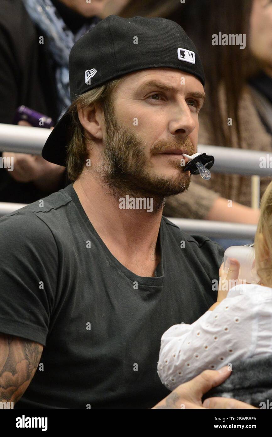 21 October 2013 David Beckham and daughter Harper watch the Los Angeles  Kings ice hockey team play Calgary Flames at the Staples Center, Los  Angeles, CA and was joined by Brooklyn and