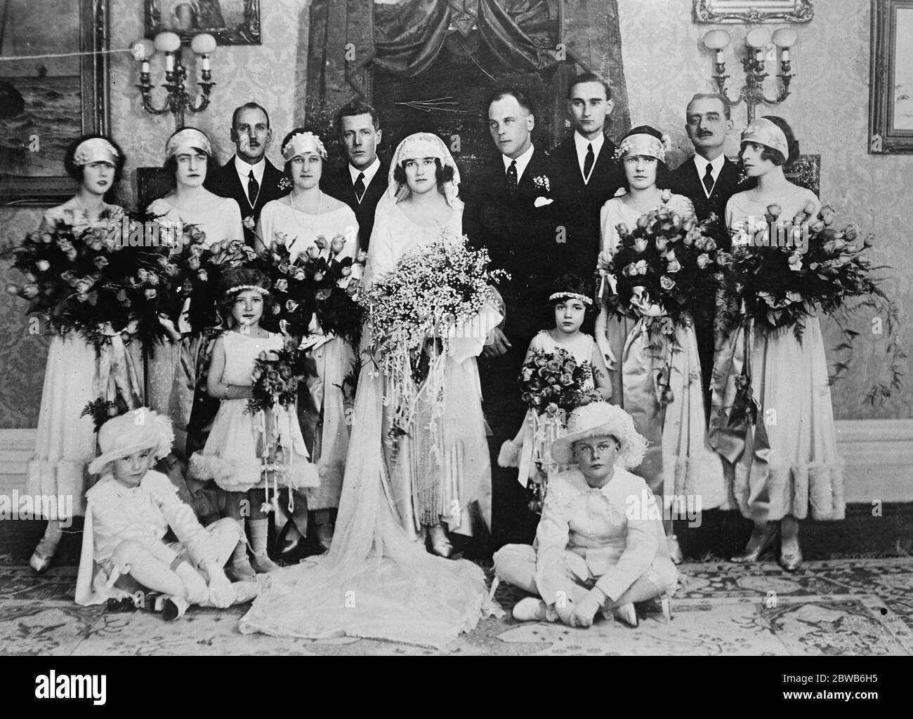 Canada ' s Royal Romance . The wedding took place at Ottawa , Canada , of Prince Erik of Denmark and Miss Lois Booth . The wedding group , back row , left to right ; Miss Betty Henderson , Lady Elizabeth Byng , Prince Viggo , Mrs W D Herridge , C O Fellowes , M C the bride , the groom , Count Leon de Moultke Huntfeldt , Miss Marjorie Cook , Count de Roussy de Sales , Lady Mary Byng . Flower girls on either side of the bride are , left to right , Miss Cynthia Davies and Miss Lilias Ahearn The pages sitting left to right ; Master Rowley Booth and Master John Bassett . 23 February 1924 Stock Photo