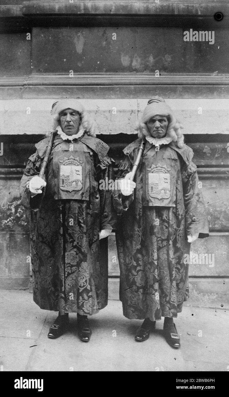 A hint to British mayors . Why not impart another touch of the picturesque in civic functions by adopting medieval costume and wigs worn by the Mayoral Mace Bearers or Heralds of Bilbao , who are shown in this picture with the civic coat of arms on their chest . 3 May 1924 Stock Photo