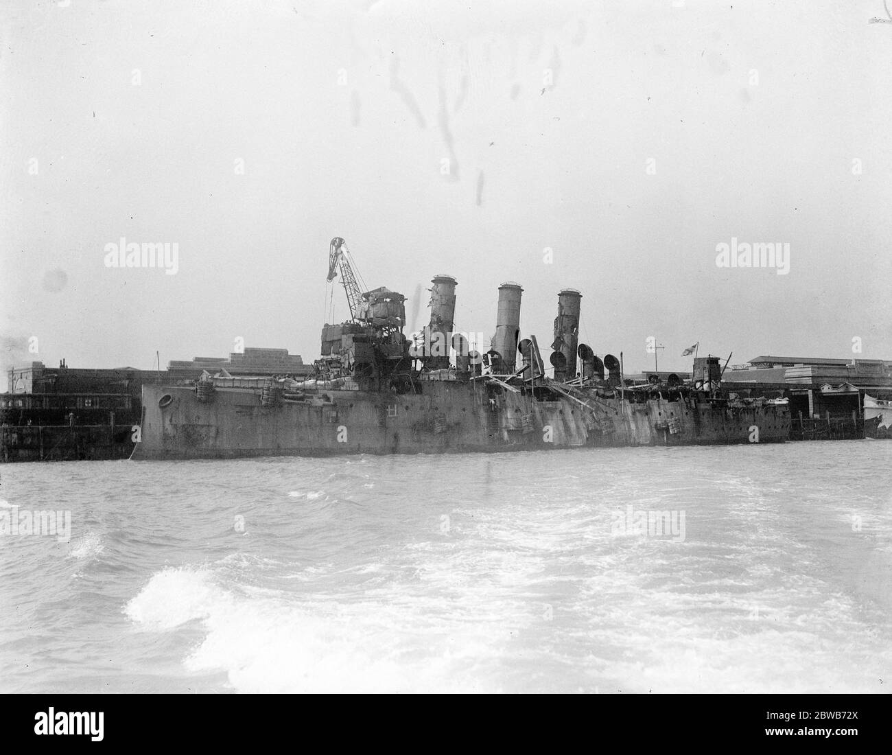 The Great Naval raid on Zeebrugge . HMS Vindictive a British protected cruiser . On 23 April 1918 she was in fierce action at Zeebrugge when she went alongside the Mole and her upperworks were badly damaged. The badly damaged HMS Vindictive seen here on her return . 1918 Stock Photo